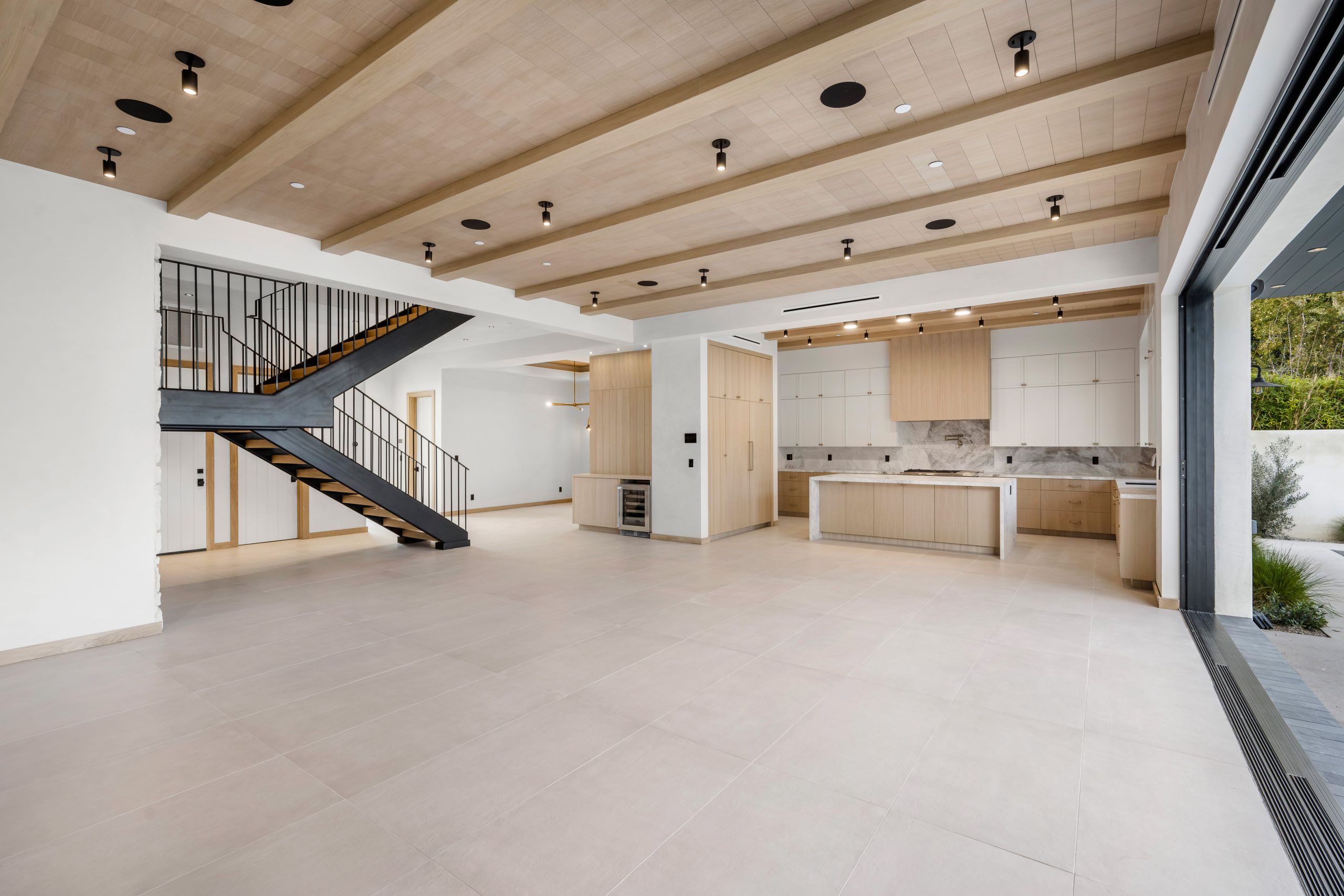 Empty interior of a house with staircase leading to the kitchen